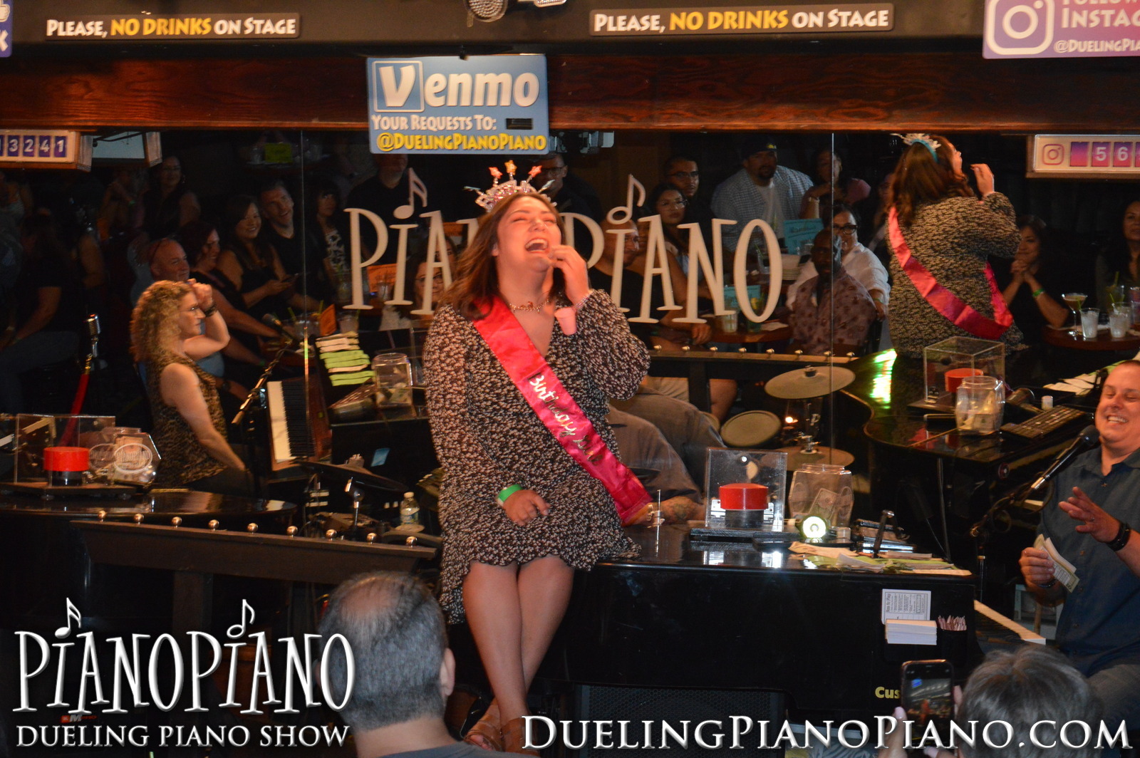 Birthday celebrant standing center stage during the PianoPiano show