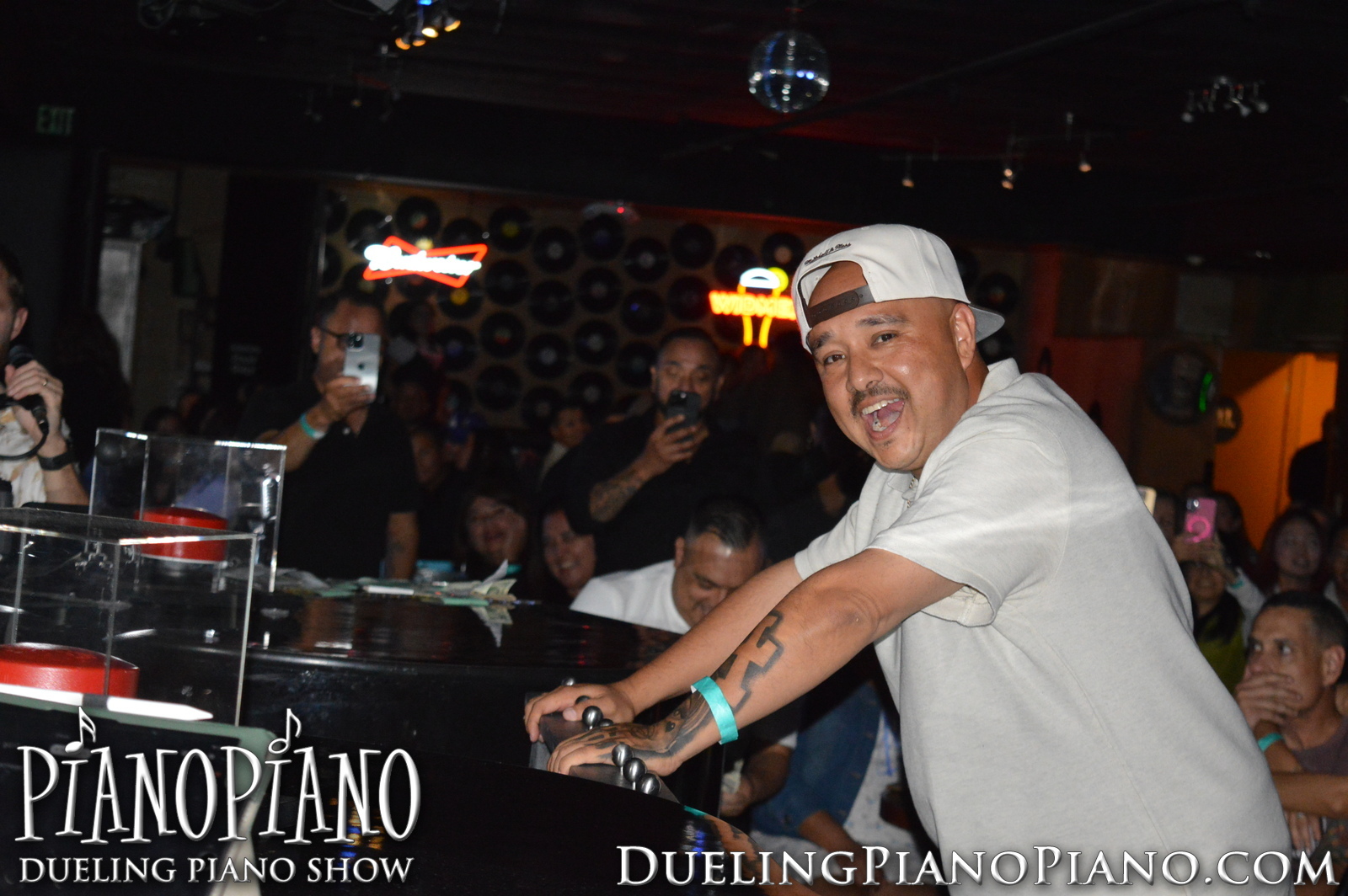 Guest seated at a piano during an interactive PianoPiano moment