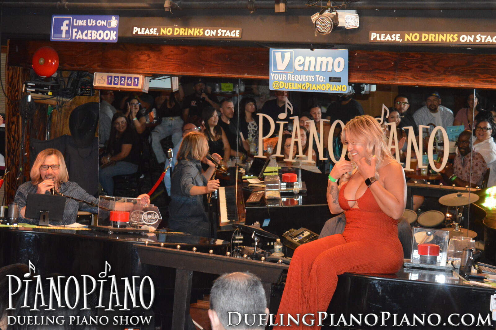 Performer and guest interacting onstage during the PianoPiano show