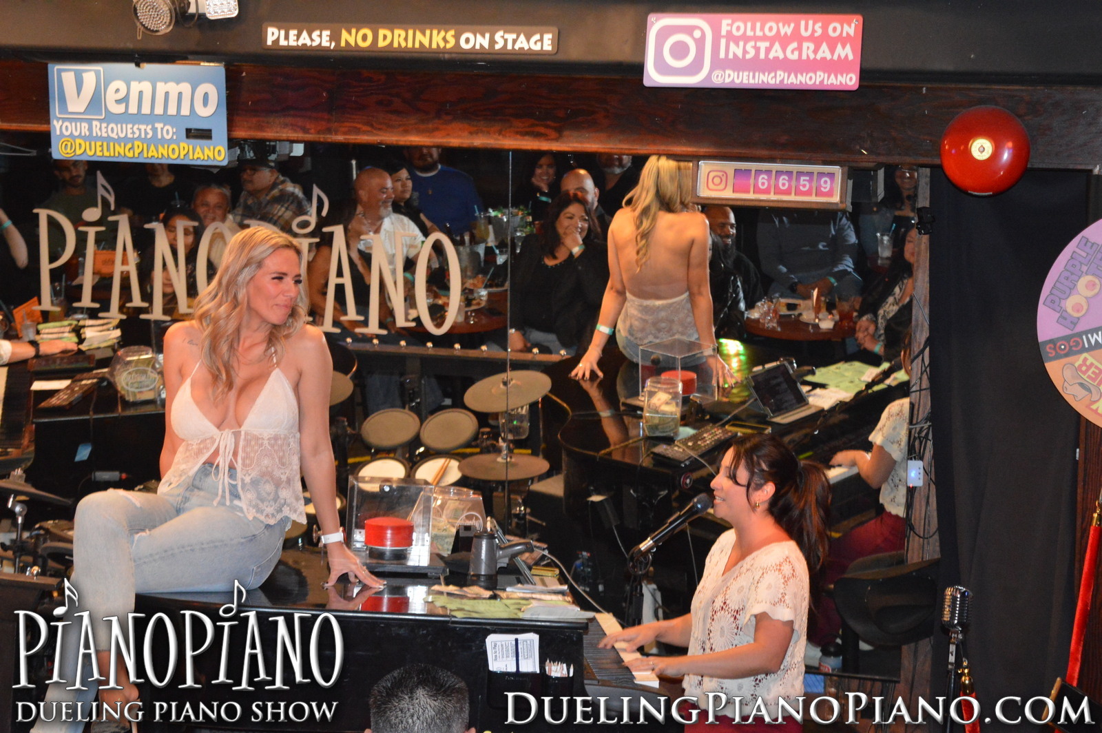 Birthday guest seated at a piano beside a PianoPiano performer